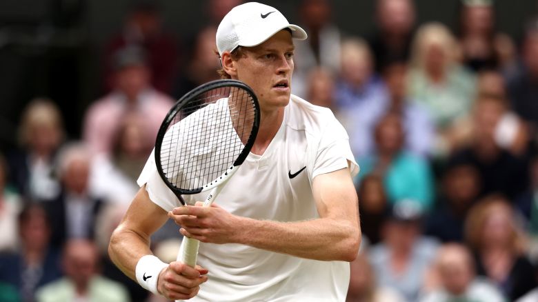 Jannik Sinner of Italy plays a backhand against Daniil Medvedev in the Gentlemen's Singles Quarter Final match during day nine of The Championships Wimbledon 2024 at All England Lawn Tennis and Croquet Club on July 09, 2024 in London, England.